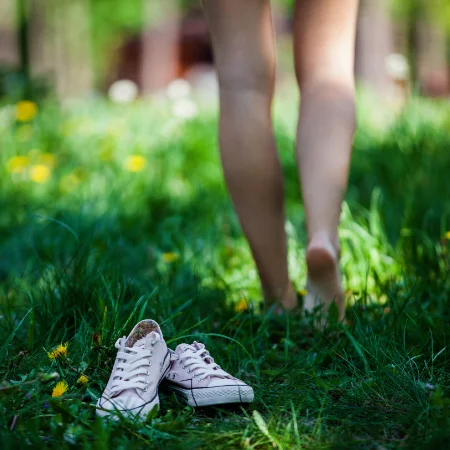Walking barefoot throught the grass.